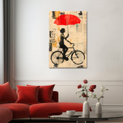 Mit dem Fahrrad mit Regenschirm